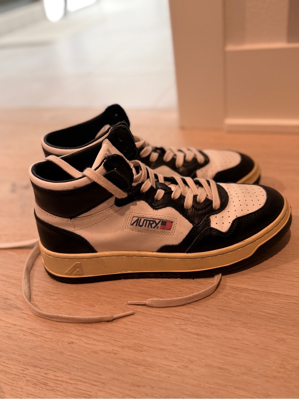 Autry Men’s Medalist Mid-Top Sneakers in Black & White